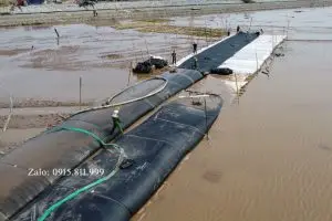 Thi Công Ống Địa Kỹ Thuật Giải Pháp đê mềm lấn biển